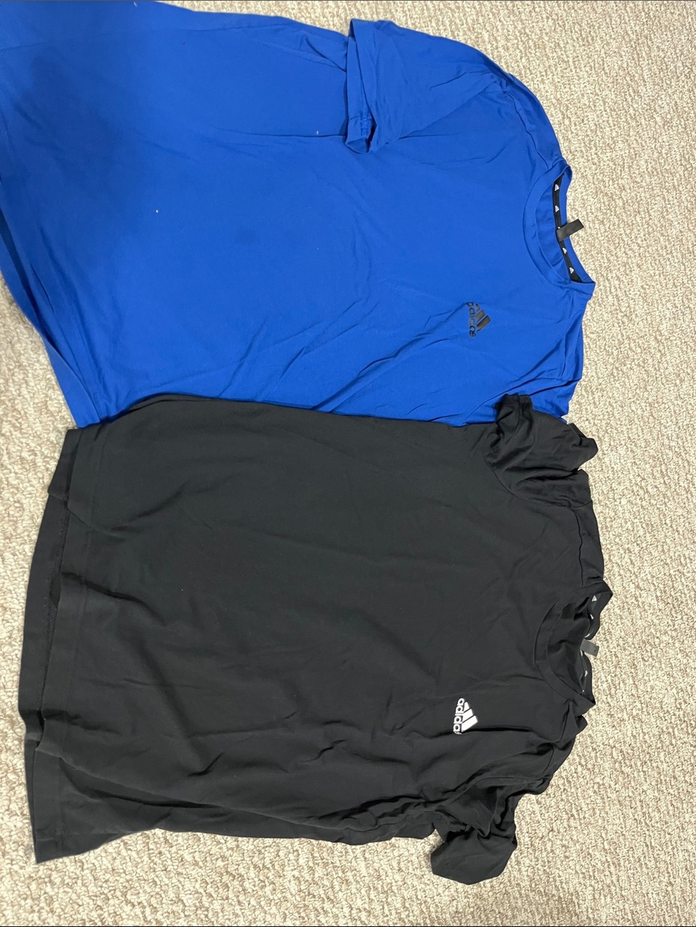 Two men’s adidas blue and black tshirts both XL